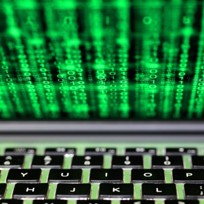 Image of laptop with green text displayed on the screen