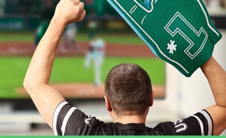 Graphic with a man watching baseball wearing a foam finger