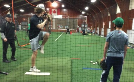 Children playing baseball at the Greely Legion - Sponsored by Xplore