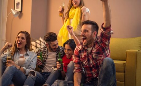 Group of friends watching the Grey Cup at home