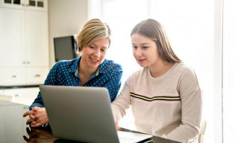 Mother & daughter using a laptop