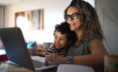 Mother and child looking at a laptop screen