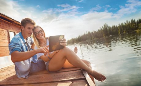 A couple enjoying fast Internet at the Cottage on the Dock