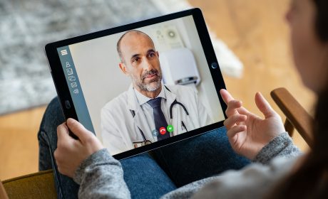 A doctor consultation with a virtual video meeting on a tablet using fast internet