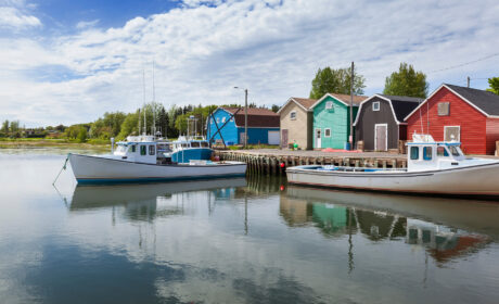A photo of colourful homes on the water in PEI