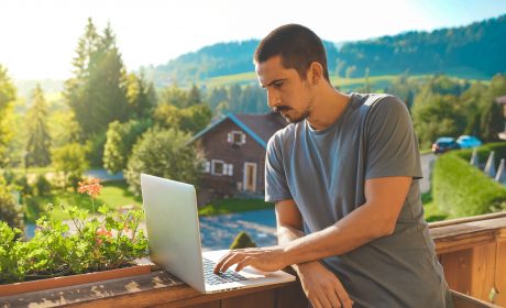 Man using laptop outside in rural Canada with Fast Internet