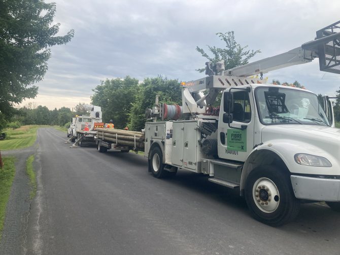 Trucks installing Xplore Fibre