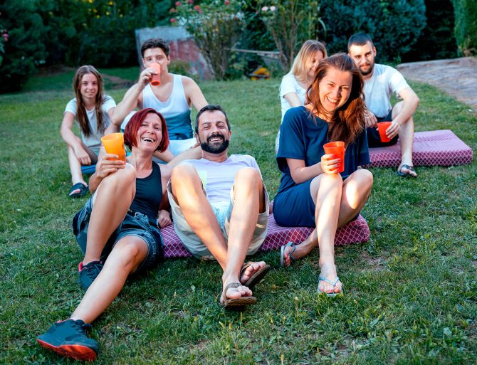 People in their backyard watching a movie