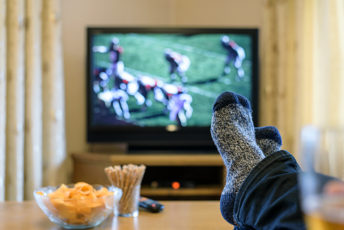 A person watching football