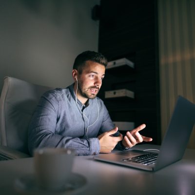 An image of an Xplore customer relying on his internet connection through a late-night conference call