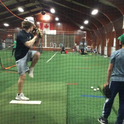 Children playing baseball at the Greely Legion - Sponsored by Xplore