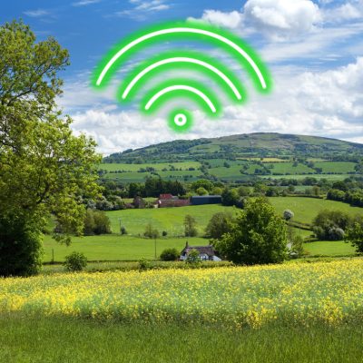 A rural landscape with a Wi-Fi symbol in the sky