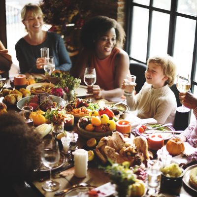 Family sitting at the table for a holiday dinner