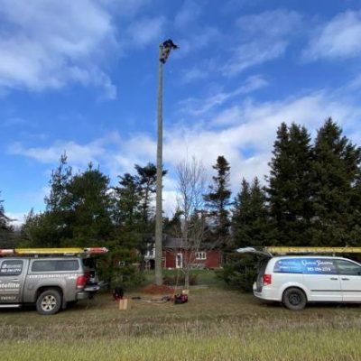 Technician vans setting up broadband Internet outside home in PEI