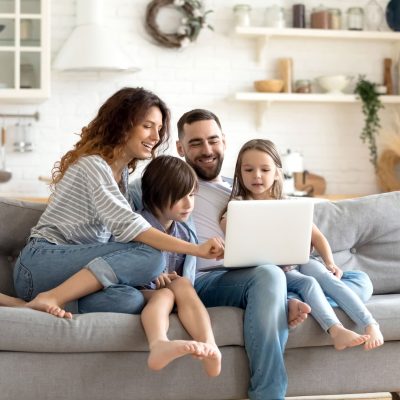 A family enjoying a reliable internet connection on their sofa