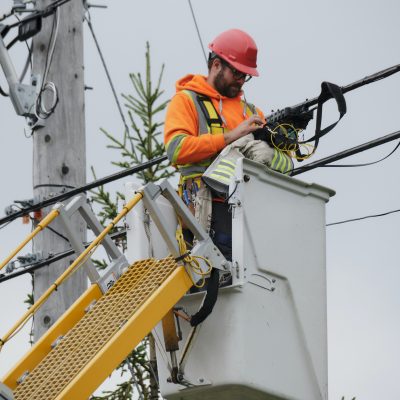 Man working on fibre lines in Quebec to bring faster Internet