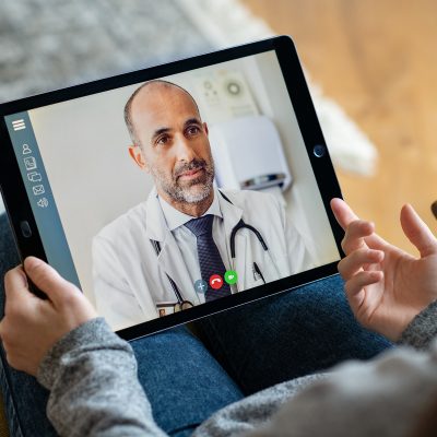 A doctor consultation with a virtual video meeting on a tablet using fast internet