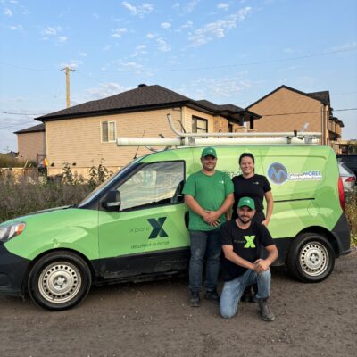 A picture of the staff from Authorized Xplore Dealer, Groupe Morel posing in front of their branded vehicle.