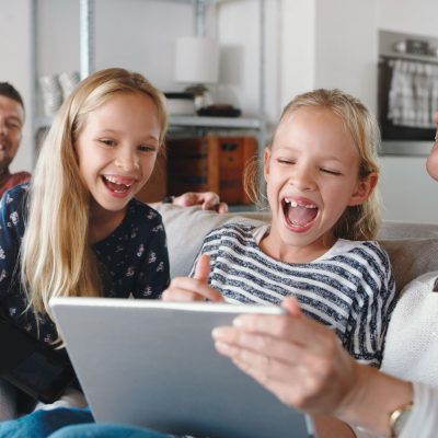 Family laughing and enjoying their fast Internet from Xplore