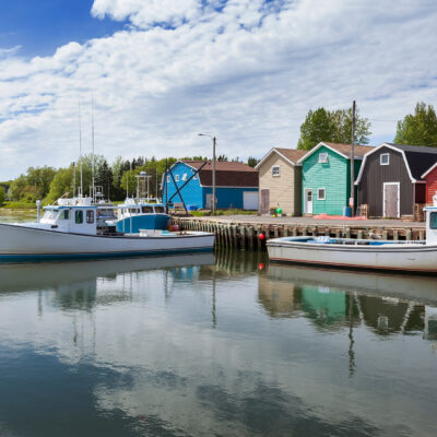A photo of colourful homes on the water in PEI