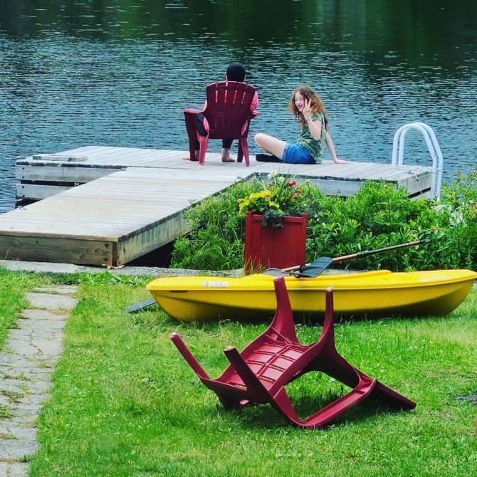 Family sitting on a dock