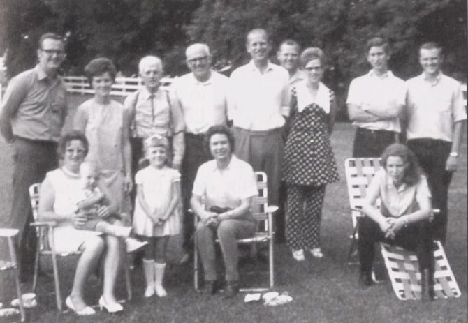 A photo of Queen Elizabeth and the royal family visiting with a Canadian family in rural Manitoba.