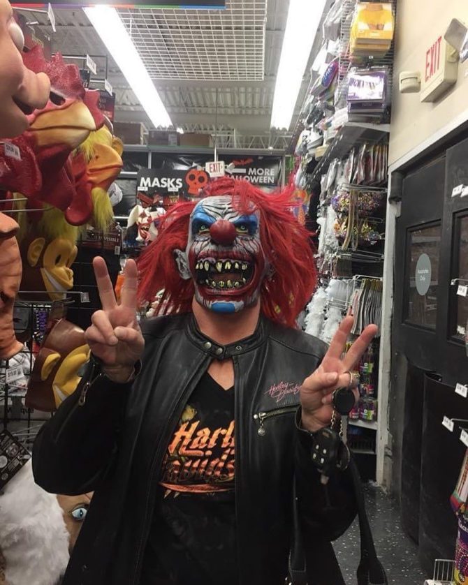 Person wearing a clown mask
