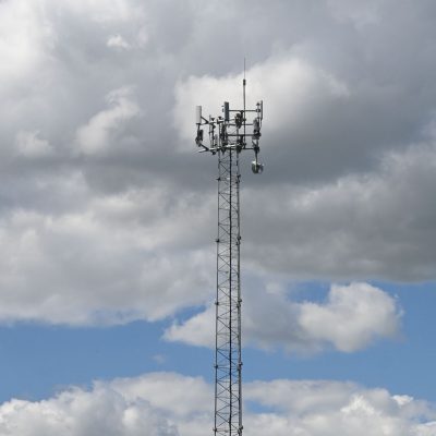 A photo of the top of the Malmo tower against a partly cloudy sky.